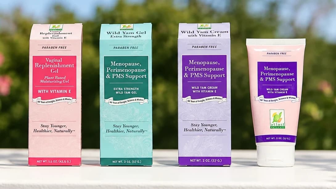 Vaginal Replenishment Gel, Extra Strength Wild Yam Gel and Wild Yam Cream boxes beside the Wild Yam Cream tube, outdoors.