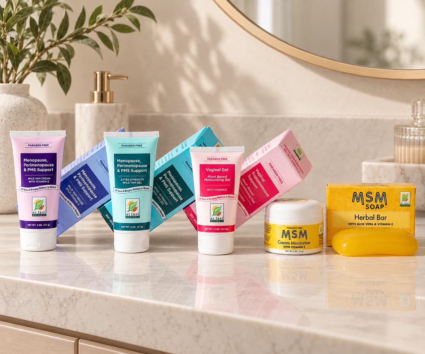 The At Last Naturals range on a bathroom counter: Wild Yam Cream, Extra Strength Wild Yam Gel, Vaginal Gel, MSM Cream Moisturizer and the MSM Herbal Bar.